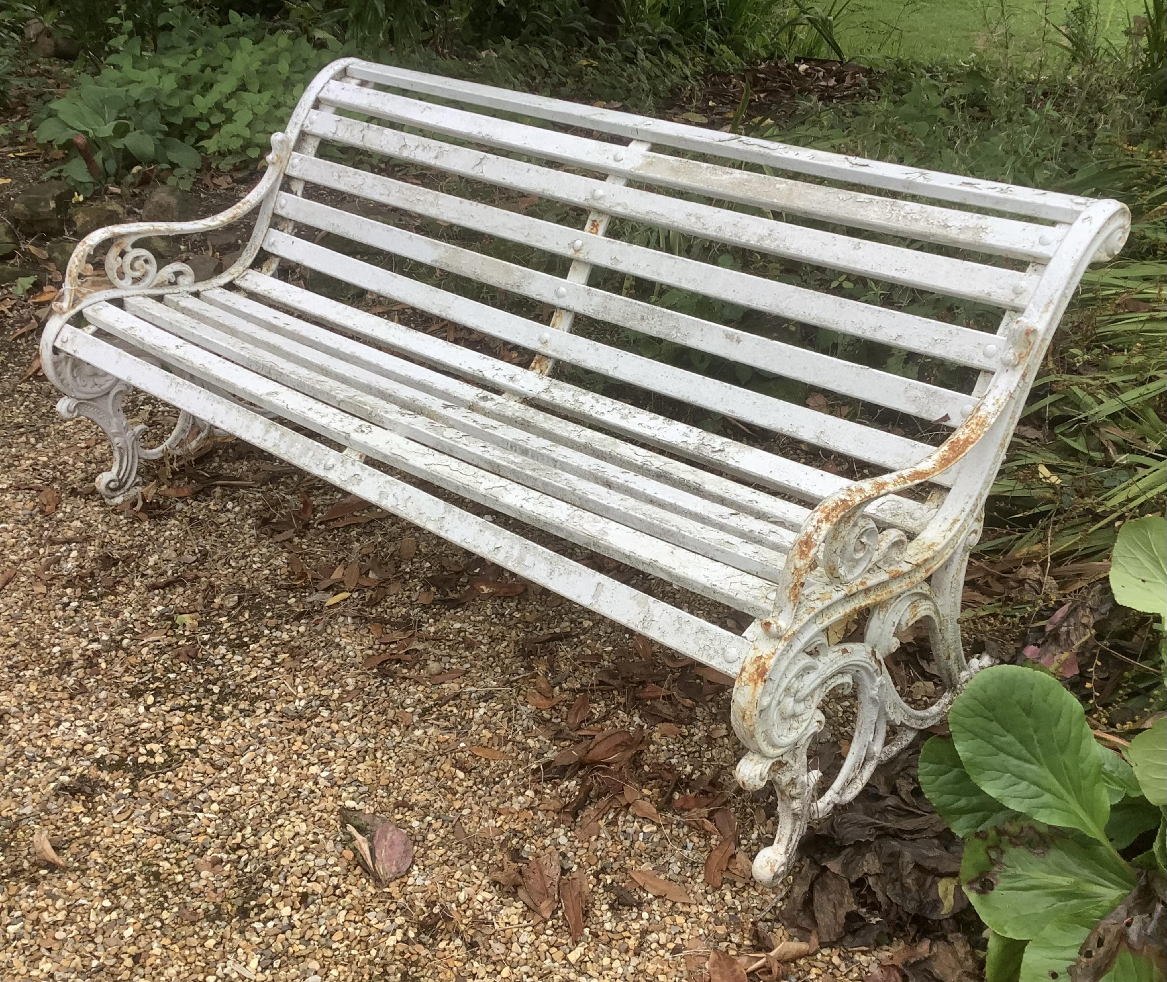 A white painted wrought iron and wood slatted garden bench, 163cm. Condition - weathered, otherwise solid